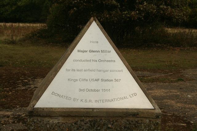 The Glenn Miller Memorial commemorates American big-band leader Major Alton Glenn Miller, who brought joy to troops and civilians during WWII before vanishing mysteriously. Located at the former RAF King’s Cliffe airfield near Peterborough, the memorial marks the exact spot where he and his orchestra played their final airfield "hangar concert" on October 3, 1944