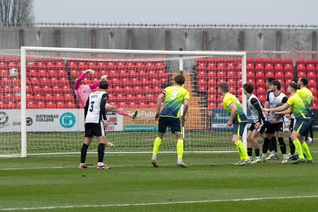 A header from Peterborough Sports' striker Michael Gash (centre) flies into the back of the Gateshead net. Photo Charles Waugh.