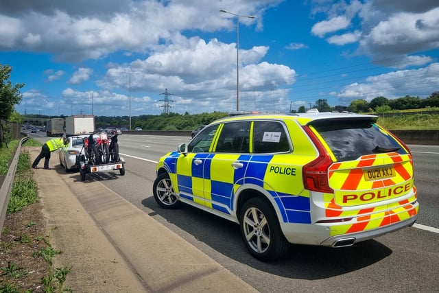 This car and trailer was travelling at 70mph in the outside lane of a motorway. Towing in the outside lane of a motorway with three or more lanes is prohibited and the maximum speed a vehicle towing can travel is 60mph. Driver reported.