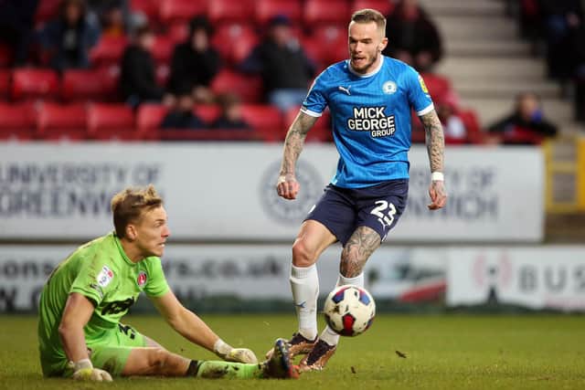 Joe Ward of Peterborough United has a shot saved by Ashley Maynard-Brewer of Charlton Athletic. Photo: Joe Dent/theposh.com.