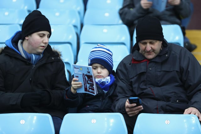 A fan reads the matchday programme prior to The Emirates FA Cup Third Round match between Aston Villa and Peterborough United at Villa Park on January 6, 2018.
