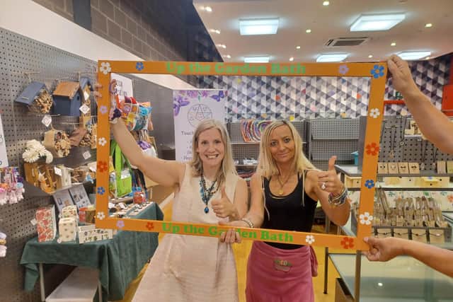 From left, Up The Garden Bath volunteer Emma Moon and co-founder Kez Hayes-Palmer in the pop-up shop in the Queensgate Shopping Centre in Peterborough.