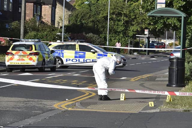 Police gather evidence at Welland Road. Photo: David Lowndes.