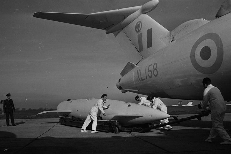 A Blue Steel missile is loaded onto a Victor bomber plane at RAF Wittering, Peterborough on 4th February 1964.