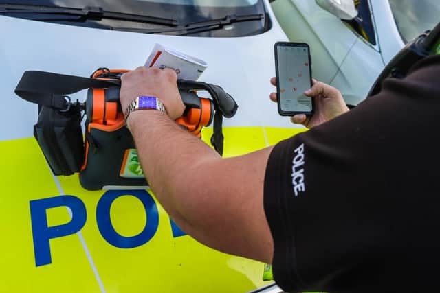 A police officer using the GoodSAM app - which was first launched in Cambridgeshire.
