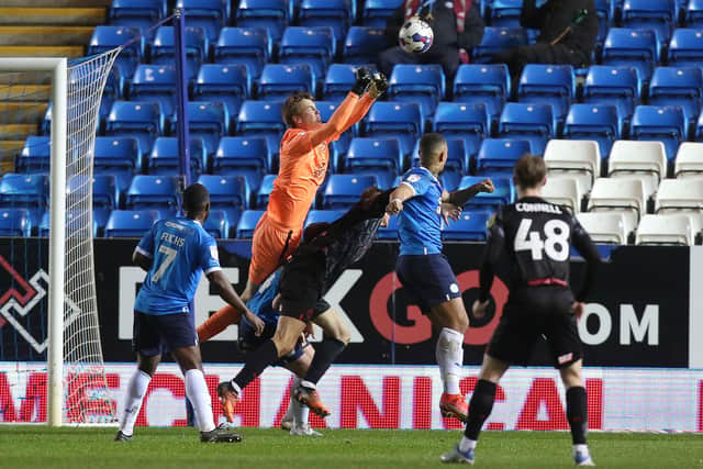 Lucas Bergstrom of Peterborough United punches the ball against Barnsley. Photo: Joe Dent/theposh.com.