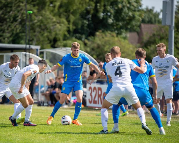 Connor Kennedy (blue) in action for Peterborough Sports last season. Photo: James Richardson