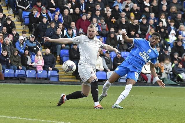 Posh striker Malik Mothersill shoots at the Exeter goal. Photo David Lowndes.
