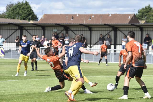 Action from Peterborough Sports (orange) v Spennymoor Town. Photo: David Lowndes.