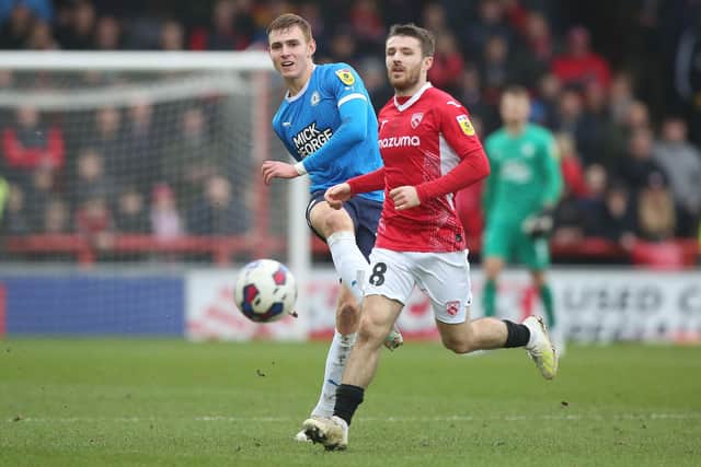 Hector Kyprianou of Peterborough United in action with Dan Crowley of Morecambe. Photo: Joe Dent/theposh.com.