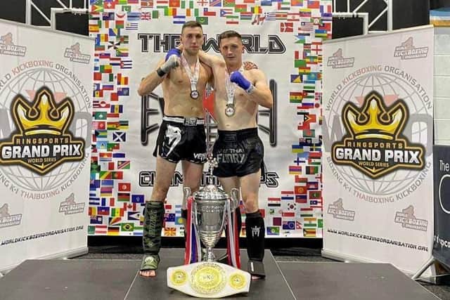 Tomas Polgrimas and Shaun Davies celebrate medal success.