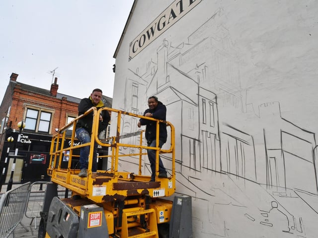 Nathan Murdock and Tony Nero working on the Cowgate mural