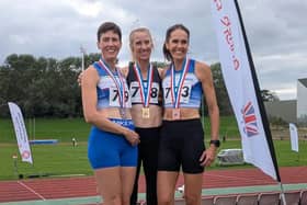 Claire Smith (right) and Kelly Sutton (left) on the podium with 400m winner Sarah Loades at the British Masters Track and Field Championship.