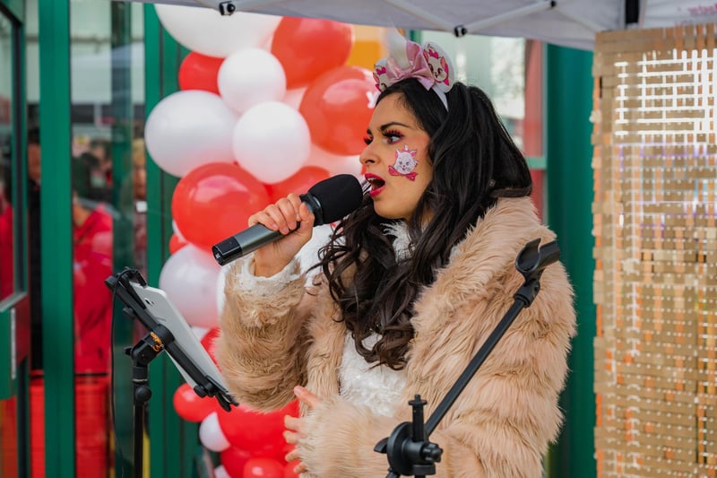 Singer Gabriella Pineda-Rodrigues performing at the official opening of the Jollyes pet store in Peterborough.