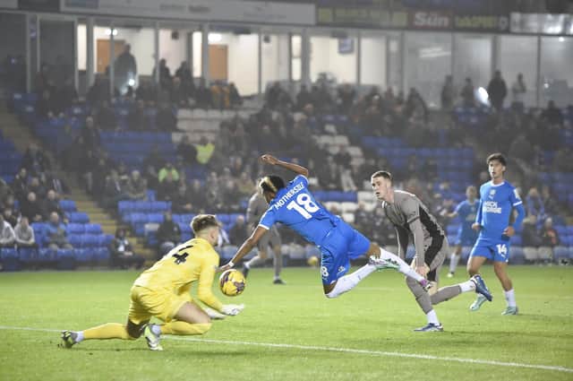 Malik Mothersille flies into action for Posh against Spurs Under 21s. Photo: David Lowndes.
