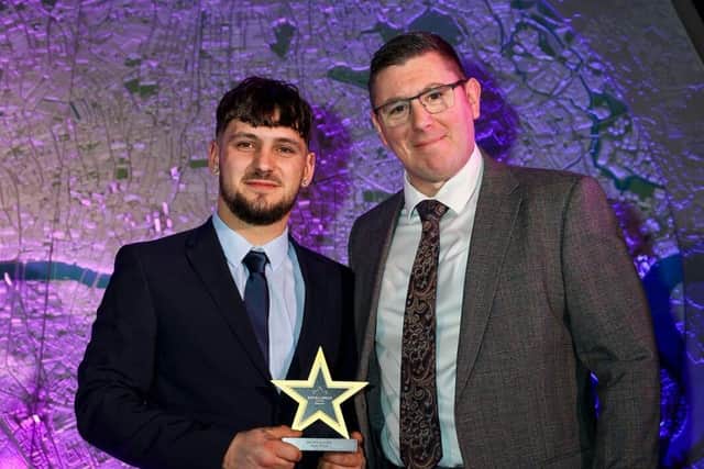 Ryan Crick collects his award from Tony Cockcroft