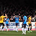 Cambridge United players and fans celebrate their second goal against Posh. Photo: Joe Dent/theposh.com.