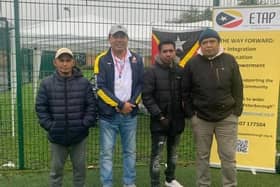 Celso Oliveira (second left) organised the community football tournament "to bring people together and break down the isolation of the migrant people."