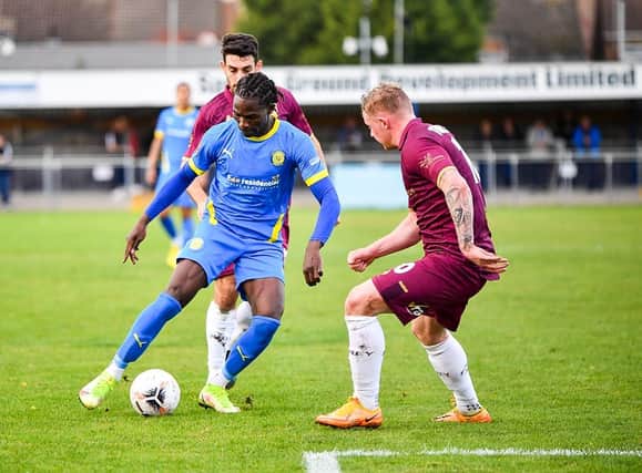 Maniche Sani (blue) in action for Sports against Chorley. Photo: James Richardson.
