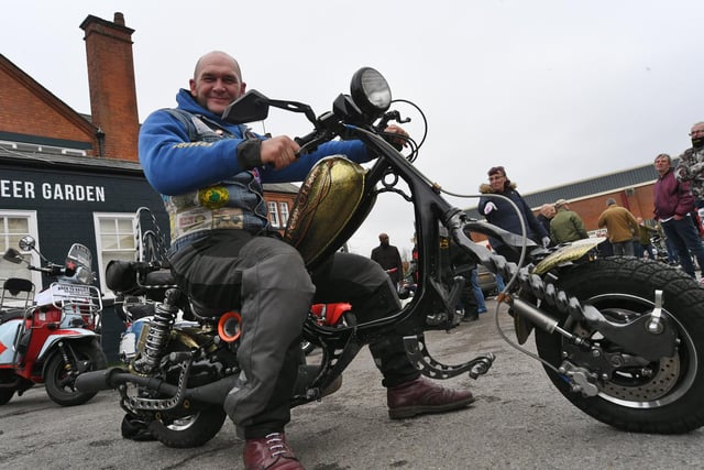 Terry Vine showing off his modified scooter at the Cross Keys pub. Scooter enthusiasts and members of the public alike enjoyed inspecting the scooters before the convoy set off.