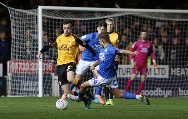 Archie Jones flies into a tackle during his one senior appearance for Posh in an EFL TRophy tie against Cambridge United in 2019. Photo: Joe Dent/theposh.com.