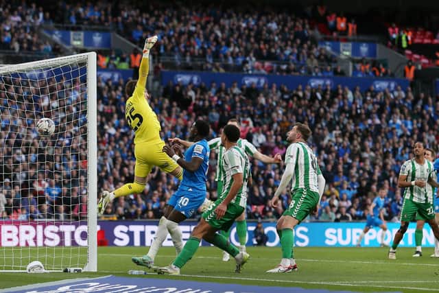 The ball has flown over the head of Wycombe Wanderers goalkeeper Franco Ravizzoli to give Posh another Wembley win. Photo Joe Dent/theposh.com