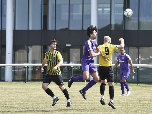 Action from the Senior Cup tie between Stanground Sports (purple) and Holbeach United Reserves. Photo: David Lowndes.