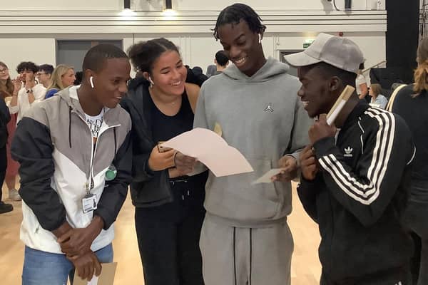 Queen Katharine Academy students Amadu Balde, Reily Chapman, Bruno Andre and Junior Poquena collecting their results.