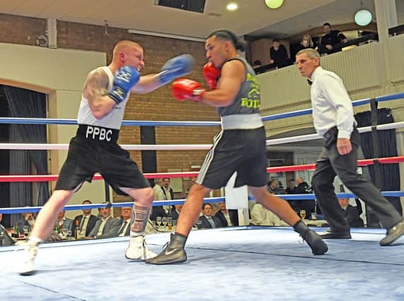 Alfie Pearce (left) in action at the Police Boxing Club show in St Ives.