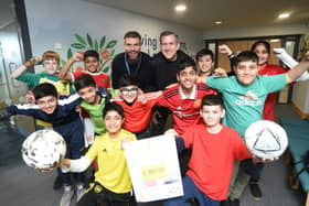 Football crazy pupils in six year at All Saints have rallied together to raise thousands for charity - Junaid Javed (bottom left) and Hisham Farooq (bottom right). Teaching staff Tim Street (left, top) and David Lowings (right, top). Image: David Lowndes