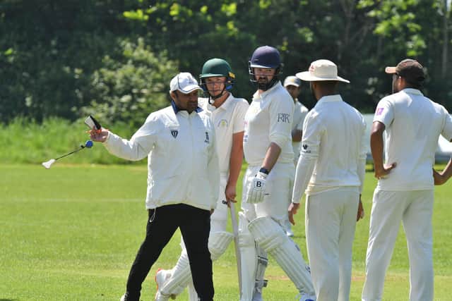 The umpire intervenes after a dispute between City CC and Burghley Park players. Photo David Lowndes.