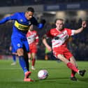 Ali Al-Hamadi (left) in action for AFC Wimbledon. (Photo by Justin Setterfield/Getty Images).