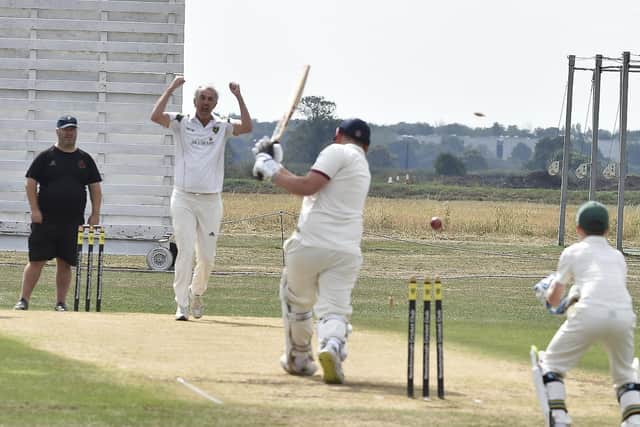 Newborough bowler Nigel Griffin gets a wicket against Heckington. Photo: David Lowndes.