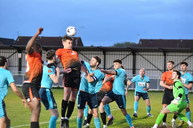 Action from Peterborough Sports (orange) v Farsley Celtic. Photo David Lowndes.