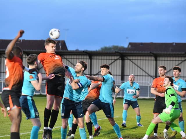 Action from Peterborough Sports (orange) v Farsley Celtic. Photo David Lowndes.