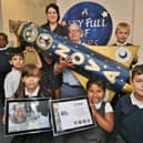 Nova Academy pupils with head teacher Alma McGonigle and teacher Andy Hudson with pupils who have received a signed photo of Tim Peake  following their school space project