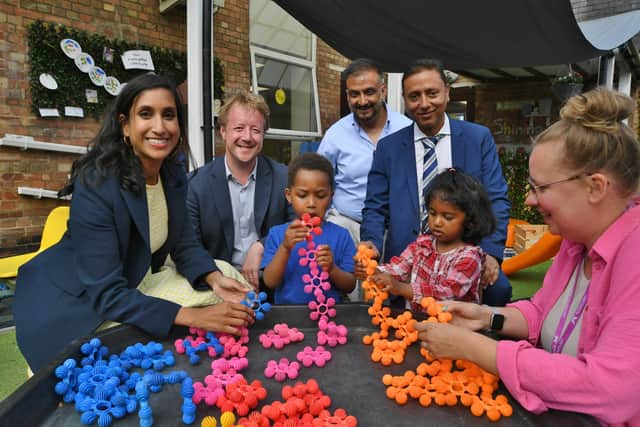 Minister for Education Claire Coutinho, with Peterborough MP Paul Bristow and play leader Rebecca Willett at the Little Stars Day Nursery with owners Mohammed Younis and Mohammed Ashraf.