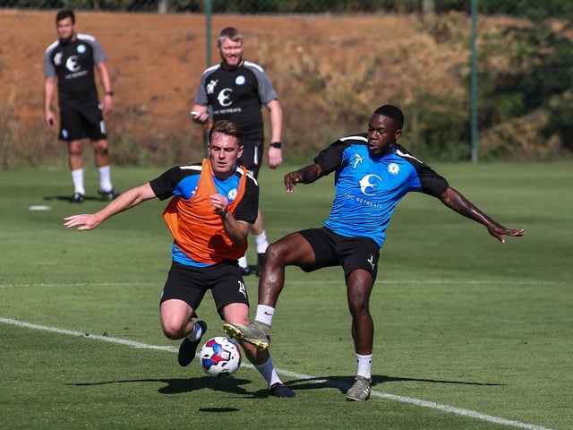 New Posh signing Ben Thompson (left) competes with Jeando Fuchs.