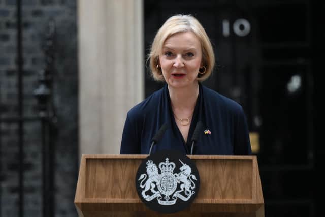 Britain's Prime Minister Liz Truss delivers a speech outside of 10 Downing Street in central London on October 20, 2022 to announce her resignation. (image: Daniel Leal/AFP via Getty Images)