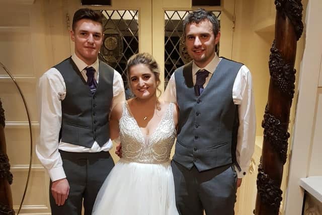 Natalie Powell with her brothers on her wedding day.