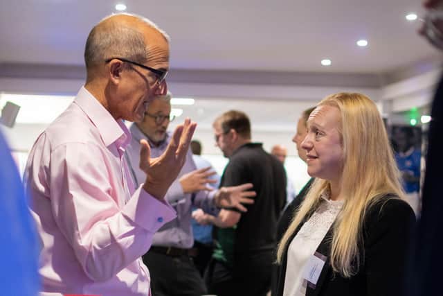 Steve Seekings from Alan Boswell Group networking with attendees and answering their questions at the Cyber Networking Breakfast