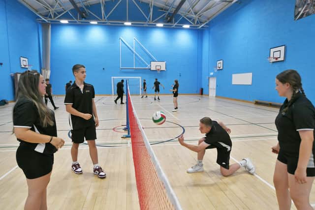 Pupils at Nene Park Academy, dressed in sports kit for the day, using the sports halls for light activity which are some of the school's cooler areas.