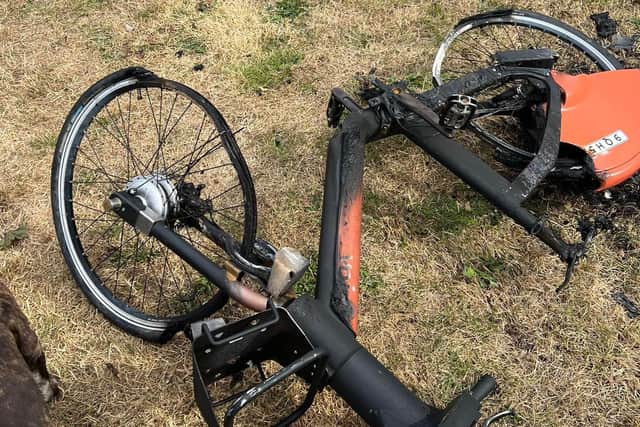 The scorched frame of the vandalised e-bike found dumped in Woodston, Peterborough.