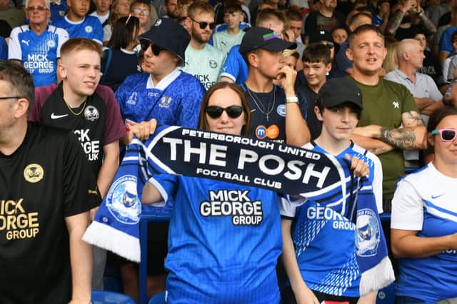 Posh fans pose for a pre-match pic.