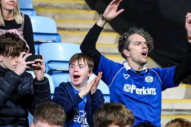 Peterborough United fans watch the 3-0 defeat Coventry City last season.