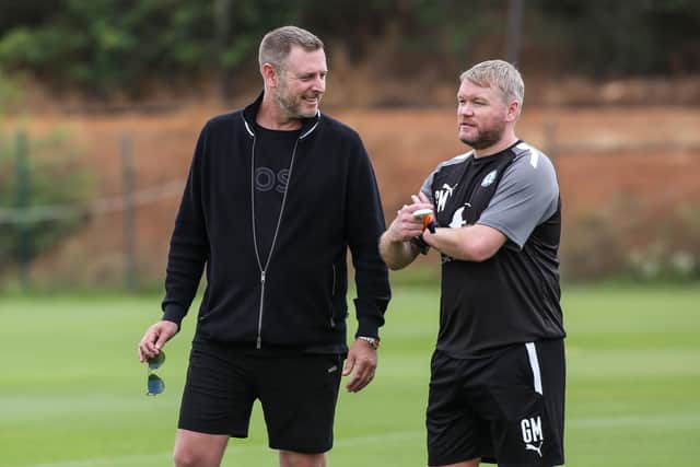 Posh chairman Darragh MacAnthony and manager Grant McCann.