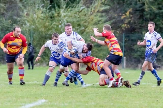 Jack Lewis of Peterborough Lions is tackled in the big city derby v Borough. Photo: Mick Sutterby.