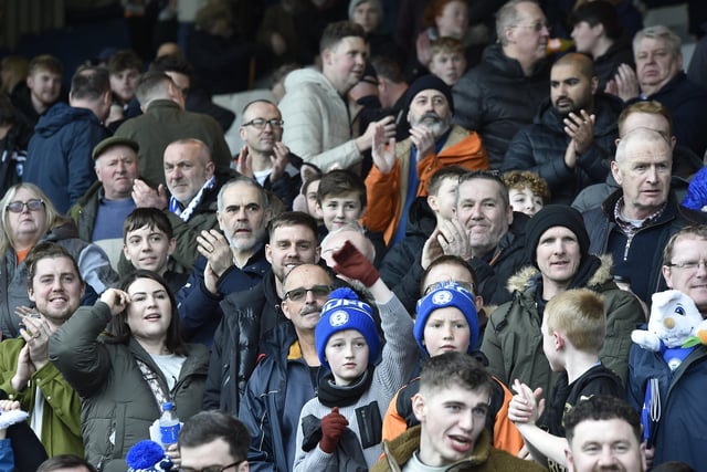 Peterborough United fans watch the defeat against Bolton Wanderers.
