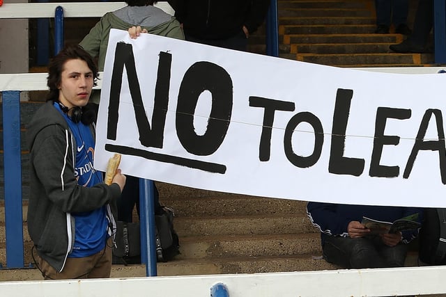 Peterborough United fans hold a banner to protest at the possible inclusion of League 3 into the Football League during the Sky Bet League One Semi Final First Leg between Peterborough United and Leyton Orient at London Road on May 10, 2014.