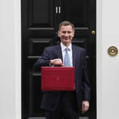 Chancellor Jeremy Hunt leaves Downing Street with the despatch box to present his spring budget to parliament on March 15 (Getty Images)
